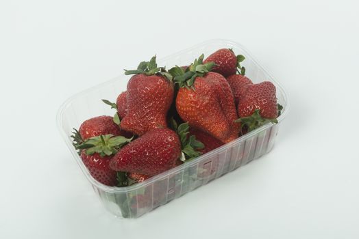 strawberries in a plastic pan