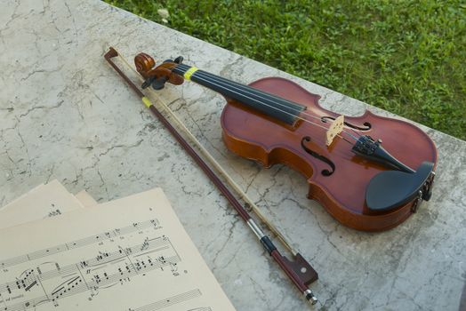 a violin and a musical score