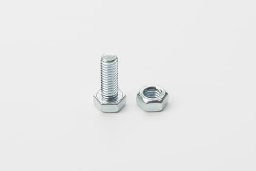 a screw and a bolt in a white background