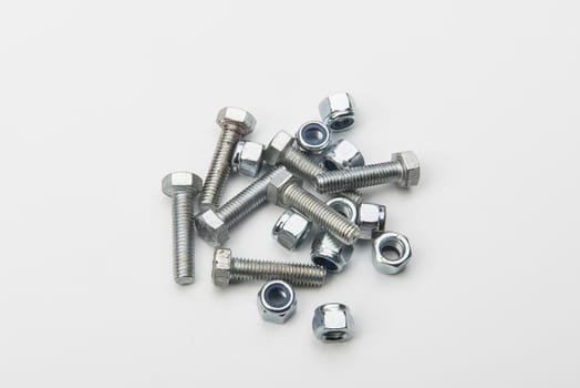 a screw and a bolt in a white background