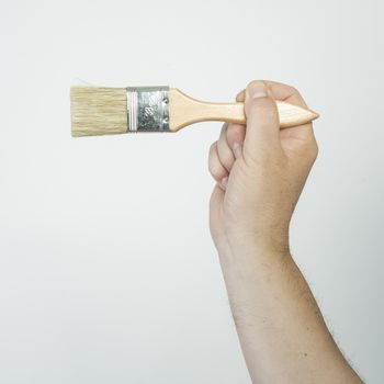 a brush in his hand