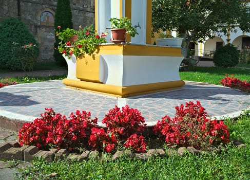 Plants blooming red flowers in monastery garden, serbia