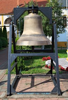 Big church bell in monastery garden, closeup