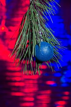 still life with Christmas decorations and a branch of a Christmas tree