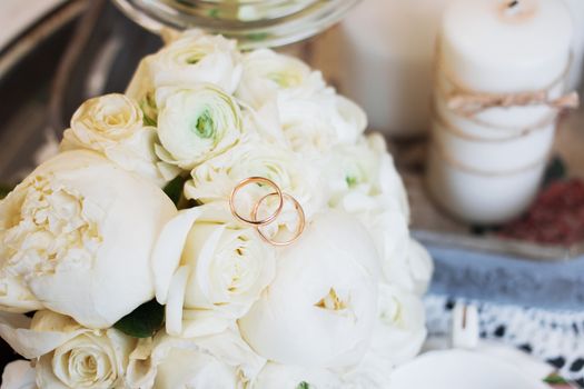 Beautiful wedding bouquet and rings. Wedding day.