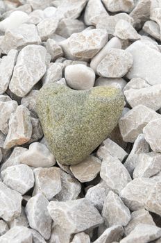 heart shaped stone on the beach
