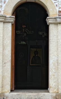 Entrance into main stone church monastery Hopovo in Serbia