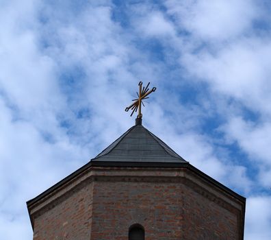 Top of bell tower on orthodox church, and clouds in background