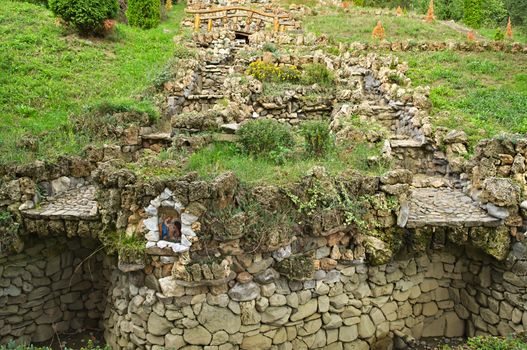 Big dry stone fountain on hill