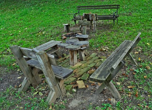 Wooden table and benches for relaxing in park