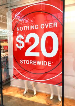 Store banner in shopfront advertises a sale with nothing over $20.00