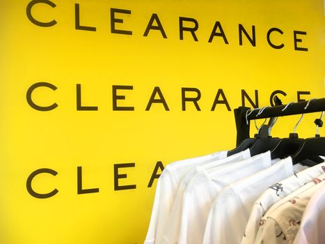 Clearance Sale Sign banner and racks of clothes