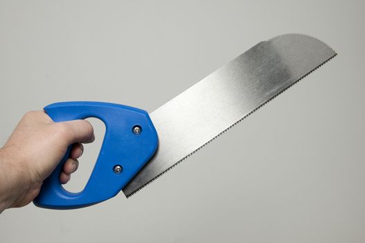 a saw in his hand