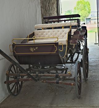 Vintage old style chariot in barn