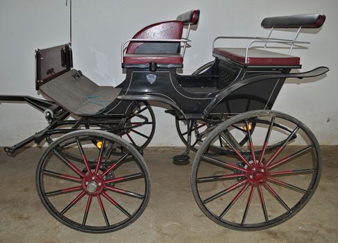 Vintage old style chariot in barn