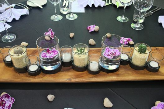 Elegant decorative arrangement with glasses on table
