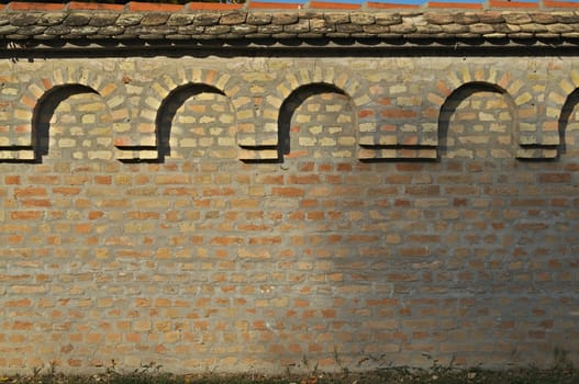 Brick fence with roof pattern texture