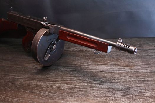 Old USA submachine gun closeup on dark background