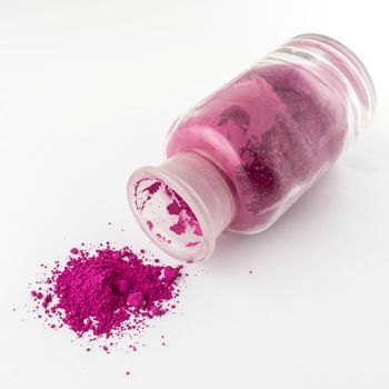 glass containers containing natural pink colored powder