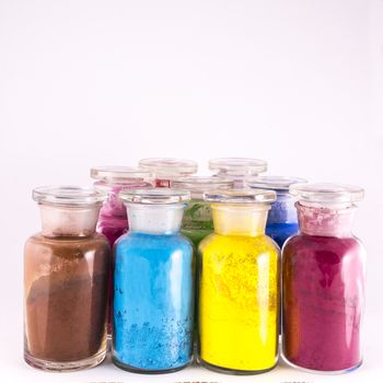 glass containers containing natural colored pigments in powder