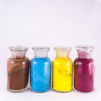 glass containers containing natural colored pigments in powder