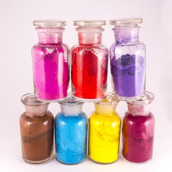 glass containers containing natural colored pigments in powder