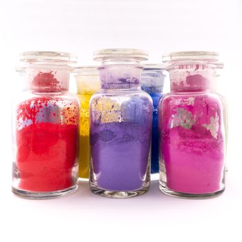 glass containers containing natural colored pigments in powder