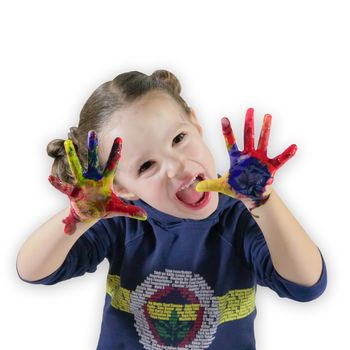 beautiful little girl with hands in the colored paint
