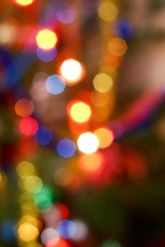 Bokeh effect on the colored lights on a Christmas tree