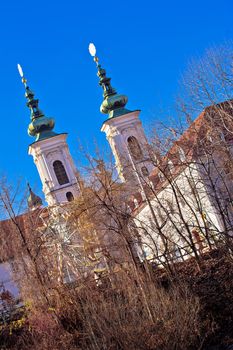 Mur river coast and church in Graz view, Steiermark region of Austria