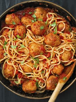 close up of rustic meatball spaghetti in tomato sauce