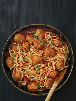 close up of rustic meatball spaghetti in tomato sauce