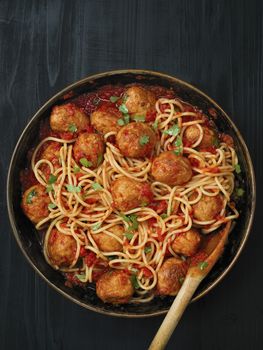 close up of rustic meatball spaghetti in tomato sauce