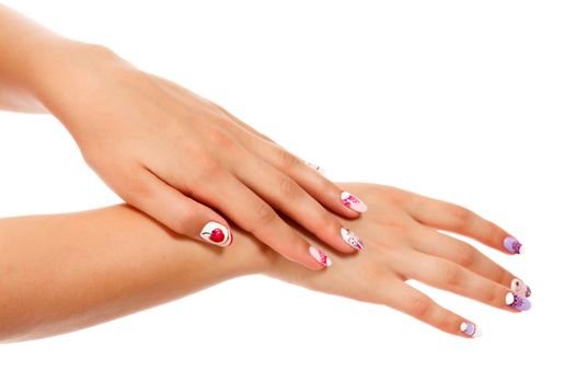 Closeup shot of beautiful female hands with manicured nails, isolated on white background