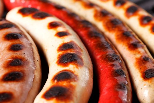 Closeup shot of sausages on a grill