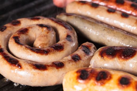 Closeup shot of sausages on a grill