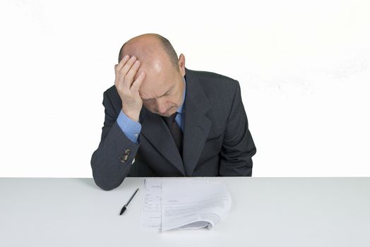 a worried man reads a document