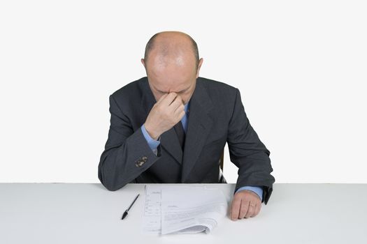 a worried man reads a document