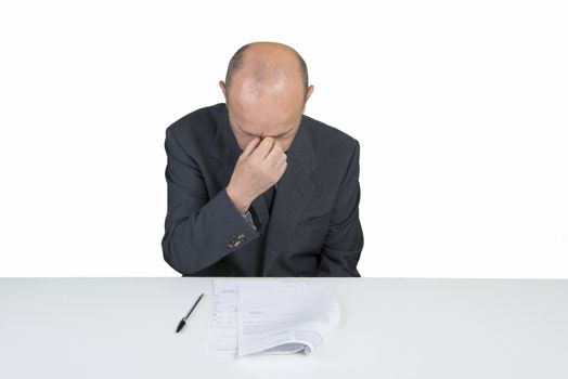 a worried man reads a document