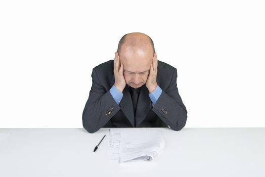 a worried man reads a document