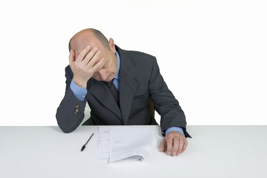 a worried man reads a document