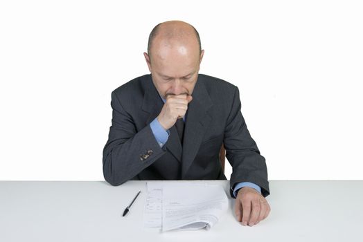 a worried man reads a document