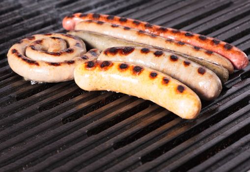 Closeup shot of sausages on a grill