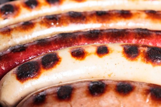 Closeup shot of sausages on a grill