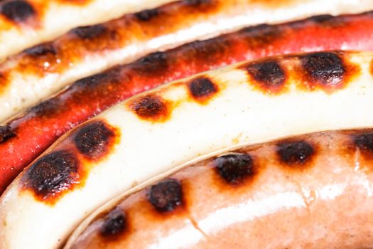 Closeup shot of sausages on a grill