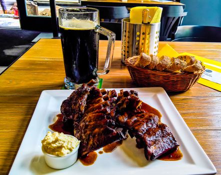 Mug of beer and plate of grilled pork ribs Prague, Czech Republic