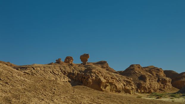 Buttes at the dried shore of Razazza lake aka Milh lake or Sea of Salt, Iraq