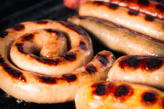 Closeup shot of sausages on a grill