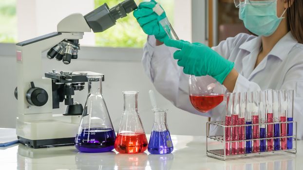 scientist with equipment and science experiments in laboratory