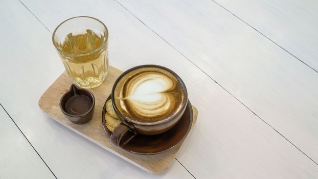 hot coffee cup and hot tea over wooden plate